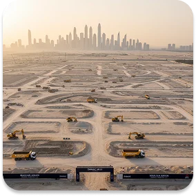 Marjan Aman Transport heavy truck fleet at UAE construction site — trucking company Dubai